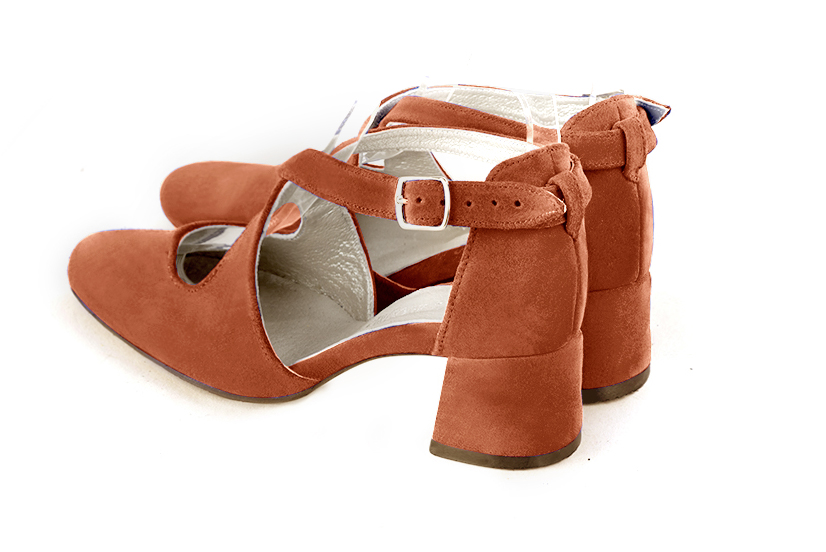 Women's terracotta orange elegant closed-back heels, with crossed straps. .  - Rear view